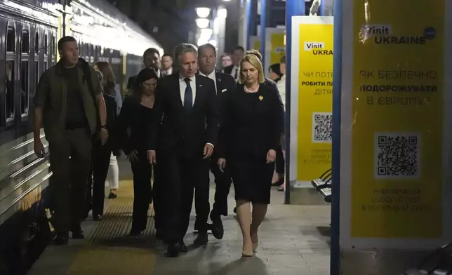 U.S. Secretary of State Antony Blinken is accompanied by U.S. Ambassador to Ukraine Bridget Brink as he prepares to depart the train station in Kyiv, Ukraine, Wednesday, Sept. 11, 2024. (AP Photo/Mark Schiefelbein, Pool)