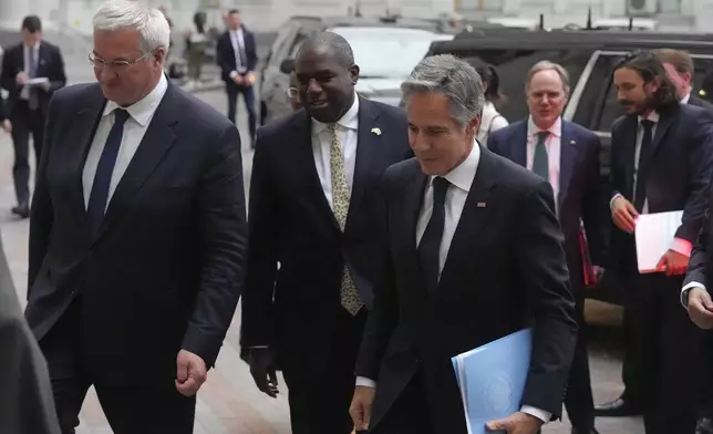 U.S. Secretary of State Antony Blinken, right, Britain's Foreign Secretary David Lammy, and Ukraine's Foreign Minister Andriiy Sybiha, left, arrive to attend a joint news conference at the Ministry of Foreign Affairs in Kyiv, Ukraine, Wednesday, Sept. 11, 2024. (AP Photo/Efrem Lukatsky)