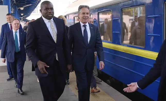 U.S. Secretary of State Antony Blinken and British Foreign Secretary David Lammy arrive at the train station in Kyiv, Ukraine, Wednesday, Sept. 11, 2024. (AP Photo/Mark Schiefelbein, Pool)