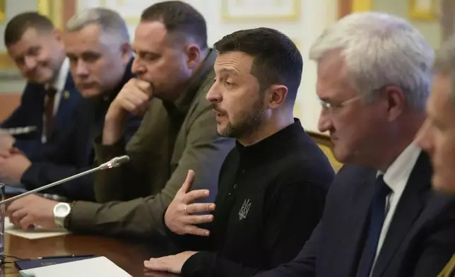 Ukraine's President Volodymyr Zelenskyy gestures during a meeting U.S. Secretary of State Antony Blinken and Britain's Foreign Secretary David Lammy at the Mariinsky Palace in Kyiv, Ukraine, Wednesday, Sept. 11, 2024. (AP Photo/Mark Schiefelbein, Pool)