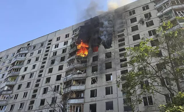 Flames rise after a Russian aerial bomb struck a multi-story residential building in Kharkiv, Ukraine, Sunday Sept. 15, 2024. (Ukrainian Presidential Press Office via AP)