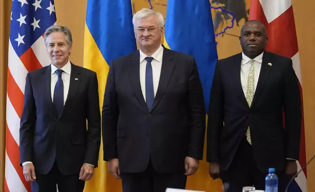 U.S. Secretary of State Antony Blinken, left, and Britain's Foreign Secretary David Lammy meet with Ukraine's Foreign Minister Andriiy Sybiha at the Ministry of Foreign Affairs in Kyiv, Ukraine, Wednesday, Sept. 11, 2024. (AP Photo/Mark Schiefelbein, Pool)