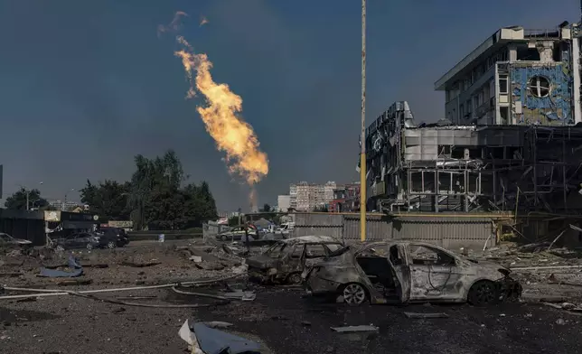 Gas burns in front of a business center damaged by a Russian attack in Kharkiv, Ukraine, Sunday, Sept. 1 2024. (AP Photo/Yevhen Titov)