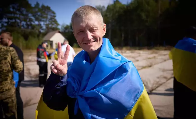 A Ukrainian reacts after being released in a prisoner exchange at an undisclosed location in Ukraine, Saturday Sept. 14, 2024. (Ukrainian Presidential Press Office via AP)