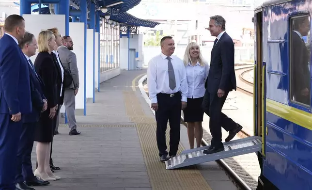 U.S. Secretary of State Antony Blinken is greeted as he arrives at the train station in Kyiv, Ukraine, Wednesday, Sept. 11, 2024. (AP Photo/Mark Schiefelbein, Pool)