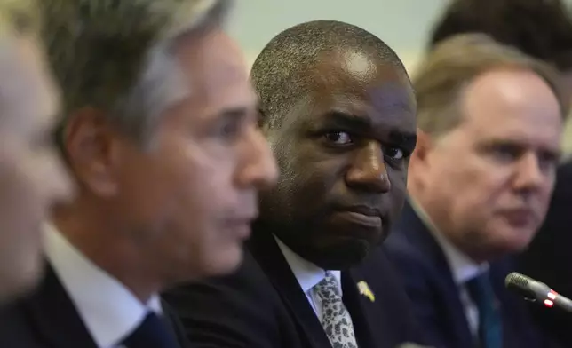 Britain's Foreign Secretary David Lammy looks at U.S. Secretary of State Antony Blinken as they meet with Ukraine's President Volodymyr Zelenskyy at the Mariinsky Palace in Kyiv, Ukraine, Wednesday, Sept. 11, 2024. (AP Photo/Mark Schiefelbein, Pool)