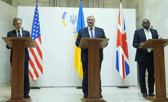 U.S. Secretary of State Antony Blinken, left, Britain's Foreign Secretary David Lammy, right, and Ukraine's Foreign Minister Andriiy Sybiha attend a joint news conference at the Ministry of Foreign Affairs in Kyiv, Ukraine, Wednesday, Sept. 11, 2024. (AP Photo/Mark Schiefelbein, Pool)