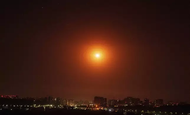 Ukrainian air defense intercepts a Shahed drone mid-air during a Russia aerial attack on the capital in Kyiv, Ukraine, Saturday, Sept. 7, 2024. (AP Photo/Evgeniy Maloletka)