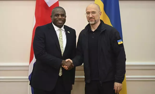 UK Foreign Secretary David Lammy attends a bilateral meeting with Ukrainian Prime Minister Denys Shmyhal Wednesday, Sept. 11, 2024 in Kyiv, Ukraine. The British Foreign Secretary joined his American counterpart on a visit to Ukraine to discuss the country's military needs in its fight against Russia. (Leon Neal/Pool via AP)