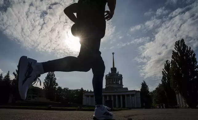 A man participates a charity run to raise awareness on Ukrainian prisoners of war held by Russia, in Kyiv, Ukraine, Saturday, Sept. 14, 2024. (AP Photo/Evgeniy Maloletka)