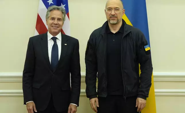 U.S. Secretary of State Antony Blinken poses for a photo with Ukraine's Prime Minister Denys Shmyhal at the Cabinet of Ministers in Kyiv, Ukraine, Wednesday, Sept. 11, 2024. (AP Photo/Mark Schiefelbein, Pool)