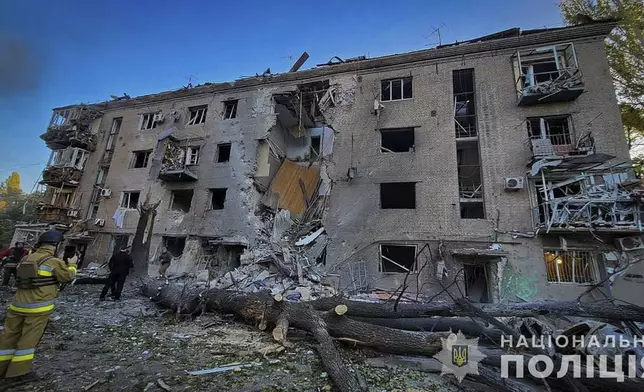 In this photo provided by the Ukrainian Police Press Office, a damaged apartment house is seen after Russia attacked the city with guided bombs overnight in Zaporizhzhia, Ukraine, Sunday, Sept. 29, 2024. (Ukrainian Police Press Office via AP)