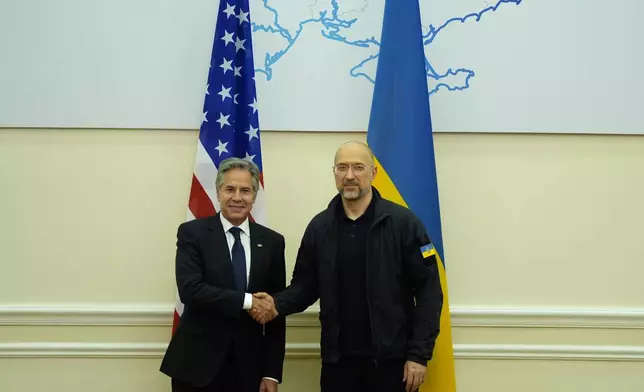 U.S. Secretary of State Antony Blinken shakes hands with Ukraine's Prime Minister Denys Shmyhal at the Cabinet of Ministers in Kyiv, Ukraine, Wednesday, Sept. 11, 2024. (AP Photo/Mark Schiefelbein, Pool)