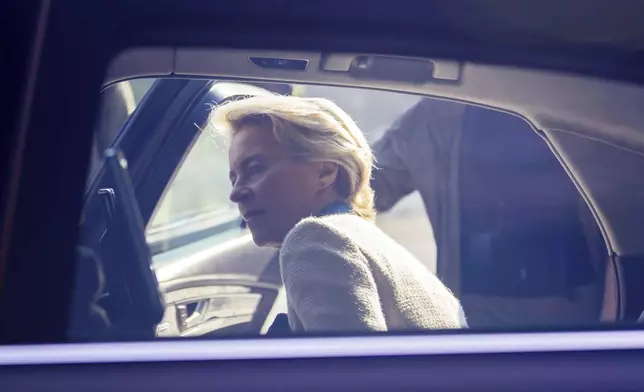 President of the European Commission Ursula von der Leyen gets into a car after visiting a memorial wall commemorating the fallen Ukrainian soldiers in the war with Russia, in Kyiv, Ukraine, Friday, Sept. 20, 2024. (Christoph Soeder, Pool via AP)