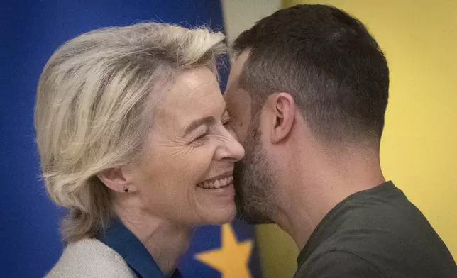 Ukrainian President Volodymyr Zelenskyy, right, and European Commission President Ursula von der Leyen greet each other in Kyiv, Ukraine, Friday, Sept. 20, 2024. (AP Photo/Efrem Lukatsky)