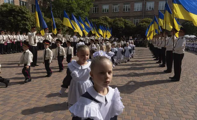 Cadets attend the first day at school in a cadet lyceum in Kyiv, Ukraine, Monday, Sept. 2, 2024. Children and students went to school despite the fact that Kyiv was hit by massive Russian missile barrage early in the morning, causing fires, damaged buildings and infrastructure objects. (AP Photo/Efrem Lukatsky)