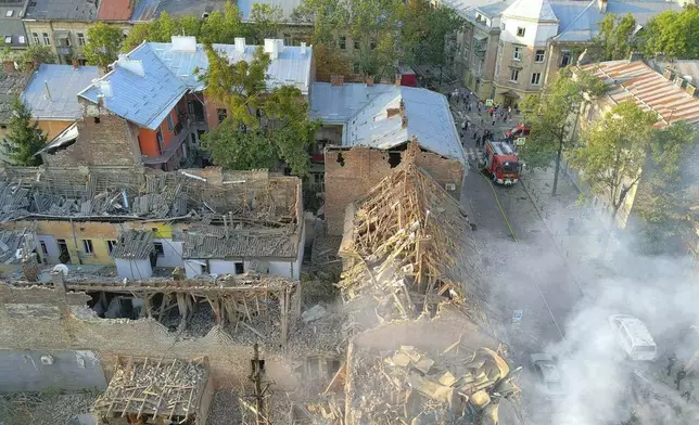 In this photo provided by the State Emergency Service of Ukraine, smoke rises from a building which was destroyed by a Russian strike in Lviv, Ukraine, Wednesday, Sept. 4, 2024. (State Emergency Service of Ukraine via AP)