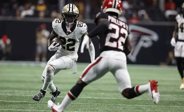 New Orleans Saints wide receiver Rashid Shaheed (22) runs against Atlanta Falcons cornerback Clark Phillips III (22) during the second half of an NFL football game, Sunday, Sept. 29, 2024, in Atlanta. (AP Photo/Butch Dill)