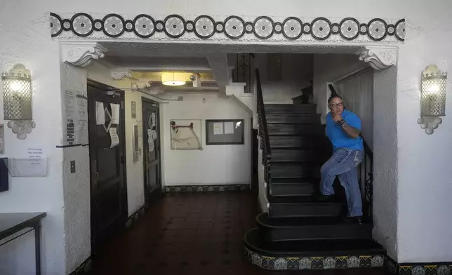 Brandi Marshall, Five Keys director of housing services, walks up the stairs while interviewed at a Five Keys transitional housing location in San Francisco, Monday, Aug. 26, 2024. (AP Photo/Jeff Chiu)