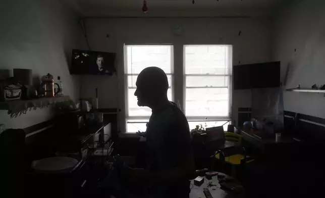 David Labogin is interviewed in his Five Keys transitional housing room in San Francisco, Monday, Aug. 26, 2024. (AP Photo/Jeff Chiu)