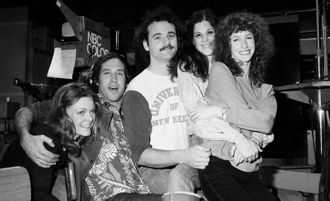 FILE - Comedian Chevy Chase, second from left, joins the cast of NBC's "Saturday Night Live," with Laraine Newman, from right, Gilda Radner, Bill Murray and Jane Curtain, left, on Feb. 16, 1978 in New York. (AP Photo/Marty Lederhandler, File)