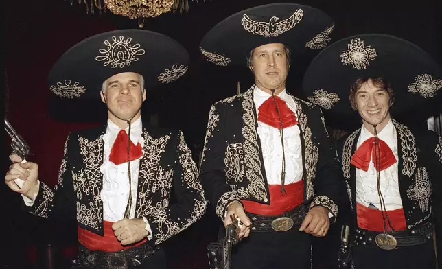 FILE - Steve Martin, from left, Chevy Chase, and Martin Short appear at the premiere of their film "Three Amigos!" in New York on Dec. 9, 1986. (AP Photo/Frankie Ziths, File)