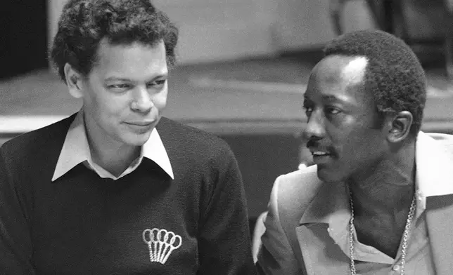 FILE - Civil Rights activist and politician Julian Bond, left, appears with "Saturday Night Live" cast member Garrett Morris during a rehearsal for the sketch comedy series on April 7, 1977, in New York. (AP Photo/Dave Pickoff, File)