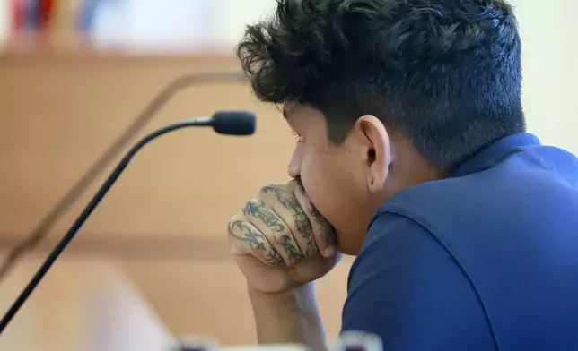 Anthony Borges listens to testimony in Judge Carol-Lisa Phillips' courtroom on Thursday, Sept. 5, 2024, in Broward County, Fla. Borges was shot five times in the mass shooting at Marjory Stoneman Douglas High School on Valentine's Day 2018. The families of the Parkland victims are in court to debate whether one plaintiff, the family of Anthony Borges, has the right to unilaterally negotiate a settlement entitling him to the rights to Nikolas Cruz's name and inheritance. (Mike Stocker /South Florida Sun-Sentinel via AP)