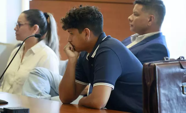 Anthony Borges listens to testimony in Judge Carol-Lisa Phillips' courtroom on Thursday, Sept. 5, 2024, in Broward County, Fla. Borges was shot five times in the mass shooting at Marjory Stoneman Douglas High School on Valentine's Day 2018. The families of the Parkland victims are in court to debate whether one plaintiff, the family of Anthony Borges, has the right to unilaterally negotiate a settlement entitling him to the rights to Nikolas Cruz's name and inheritance. (Mike Stocker /South Florida Sun-Sentinel via AP)