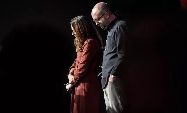 Lead Pastor Jason Britt and is wife Nan Britt pray during a Sunday service at Bethlehem Church, Sunday, Sept. 8, 2024, in Bethlehem, Ga. Colt Gray, 14, has been charged with murder over the killing of two students and two teachers at Apalachee High School in Barrow County, outside Atlanta, on Wednesday. (AP Photo/Mike Stewart)