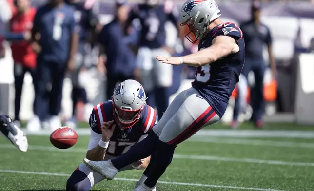 New England Patriots place kicker Joey Slye, right, kicks a field goal in front of punter Bryce Baringer, left, in the first half of an NFL football game against the Seattle Seahawks, Sunday, Sept. 15, 2024, in Foxborough, Mass. (AP Photo/Charles Krupa)