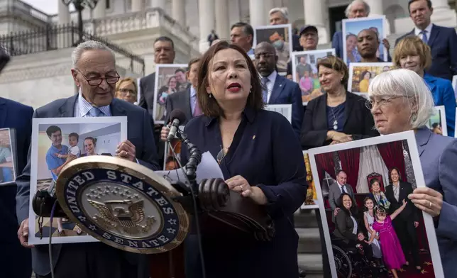 Sen. Tammy Duckworth, D-Ill., center, accompanied by Senate Majority Leader Chuck Schumer, D-NY, left, and Sen. Patty Murray, D-Wash., right, speaks about the need to protect rights to in vitro fertilization (IVF), on the Senate steps at the Capitol in Washington, Tuesday, Sept. 17, 2024. (AP Photo/Ben Curtis)