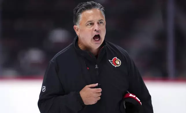 Ottawa Senators head coach Travis Green yells instructions to his players during NHL hockey training camp in Ottawa, Ontario, Thursday, Sept. 19, 2024. (Sean Kilpatrick/The Canadian Press via AP)