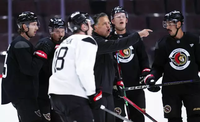 Ottawa Senators head coach Travis Green yells instructions to his players during NHL hockey training camp in Ottawa, Ontario, Thursday, Sept. 19, 2024. (Sean Kilpatrick/The Canadian Press via AP)