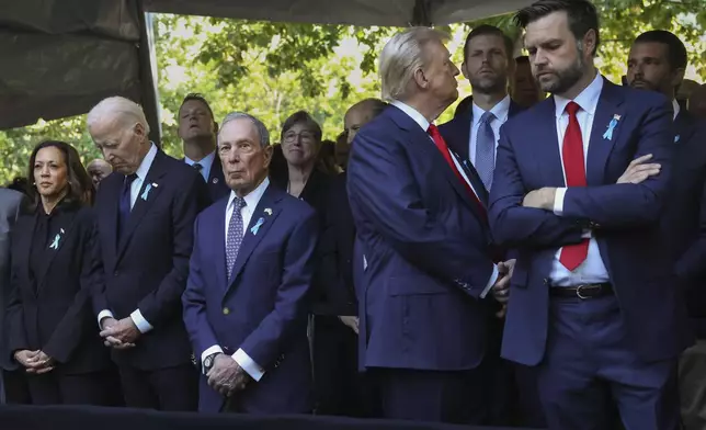 Republican presidential nominee former President Donald Trump, second from right, looks away while attending the 9/11 Memorial ceremony with Republican vice presidential nominee Sen. JD Vance, R-Ohio, right, President Joe Biden, second from left, Democratic presidential nominee Vice President Kamala Harris, far left, and Michael Bloomberg, on the 23rd anniversary of the Sept. 11, 2001 terror attacks, Wednesday, Sept. 11, 2024, in New York. (AP Photo/Yuki Iwamura)