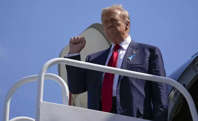 Republican presidential nominee former President Donald Trump arrives in Johnstown, Pa., en route to the Flight 93 Memorial, Wednesday, Sept. 11, 2024. (AP Photo/Matt Rourke)