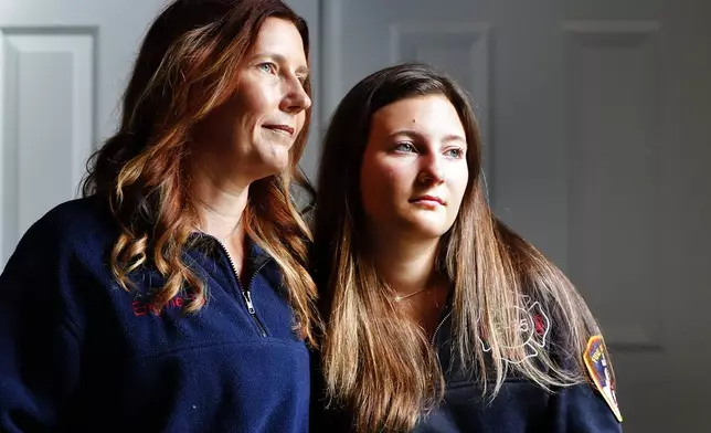 Pamela Yarosz and her daughter Capri, relatives of New York firefighter Christopher Michael Mozzillo, are photographed Saturday, Sept. 7, 2024, in Freehold,N.J.. Mozzillo, who died in the 9/11 attacks, was Pamela's brother. (AP Photo/Noah K. Murray)