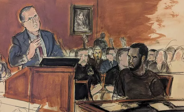 In this courtroom sketch, Sean Combs, seated right, looks at his attorney, Marc Agnifilo, left, as he delivers his bail argument as Combs' family in the gallery, background, raise their hands indicating to Judge Tarnofsky that they are in attendance, to bolster the defense attorney's bail argument, Tuesday, Sept. 17, 2024, in Manhattan Federal Court in New York. (Elizabeth Williams via AP)