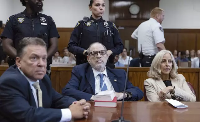 Harvey Weinstein, center, appears in criminal court in New York, Wednesday, Sept. 18, 2024. (Jeenah Moon/Pool Photo via AP)