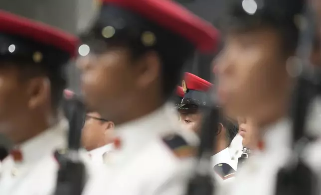 The guard of honor is lined up awaiting the arrival of Pope Francis for a welcome ceremony with the President of the Singapore Republic Tharman Shanmugaratnam at the Parliament House in Singapore, Thursday, Sept. 12, 2024. Pope Francis flew to Singapore on Wednesday for the final leg of his trip through Asia, arriving in one of the world's richest countries from one of its poorest after a record-setting final Mass in East Timor. (AP Photo/Gregorio Borgia)