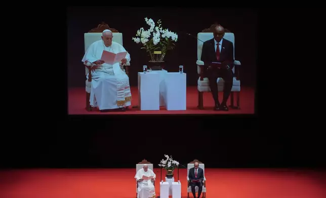 Pope Francis with Singapore's President Tharman Shanmugaratnam, right, attends a meeting with the authorities, civil society and the diplomatic corps in the theatre of the Cultural Centre of the National University of Singapore, Thursday, Sept. 12, 2024. Pope Francis flew to Singapore on Wednesday for the final leg of his trip through Asia, arriving in one of the world's richest countries from one of its poorest after a record-setting final Mass in East Timor. (AP Photo/Gregorio Borgia)