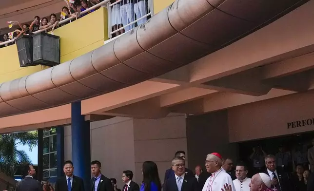 From right, Pope Francis, Archbishop of Singapore William Seng Chye Goh, and Minister of Culture Edwin Tong attend an interreligious meeting with young people at the Catholic Junior College in Singapore, Friday, Sept. 13, 2024. Pope Francis is wrapping up his visit to Singapore by praising its tradition of interfaith harmony. (AP Photo/Gregorio Borgia)