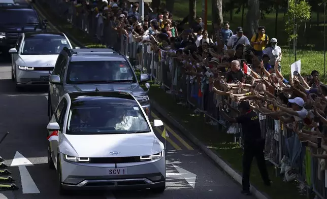 Pope Francis and entourage leave St Theresa's Home in Singapore, Friday, Sept. 13, 2024. (AP Photo/Suhaimi Abdullah)