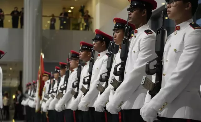 The guard of honor is lined up awaiting the arrival of Pope Francis for a welcome ceremony with the President of the Singapore Republic Tharman Shanmugaratnam at the Parliament House in Singapore, Thursday, Sept. 12, 2024. Pope Francis flew to Singapore on Wednesday for the final leg of his trip through Asia, arriving in one of the world's richest countries from one of its poorest after a record-setting final Mass in East Timor. (AP Photo/Gregorio Borgia)