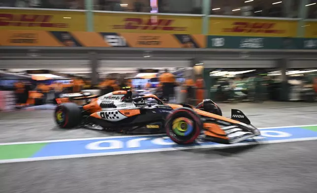 McLaren driver Lando Norris of Britain leaves the pit lane during the qualifying session of the Singapore Formula One Grand Prix at the Marina Bay Street Circuit, in Singapore, Saturday, Sept. 21, 2024. (Mohd Rasfan/Pool Photo via AP)