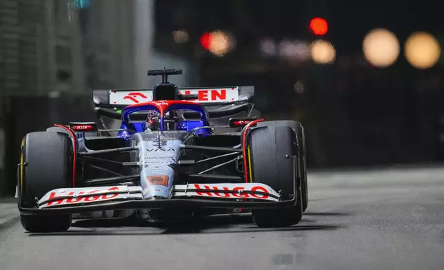 RB driver Daniel Ricciardo of Australia steers his car during the Singapore Formula One Grand Prix at the Marina Bay Street Circuit, in Singapore, Sunday, Sept. 22, 2024. (AP Photo/Vincent Thian)