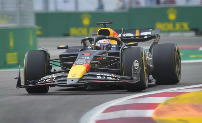 Red Bull driver Max Verstappen of the Netherlands steers his car during the first practice session of the Singapore Formula One Grand Prix at the Marina Bay Street Circuit, in Singapore, Friday, Sept. 20, 2024. (AP Photo/Vincent Thian)