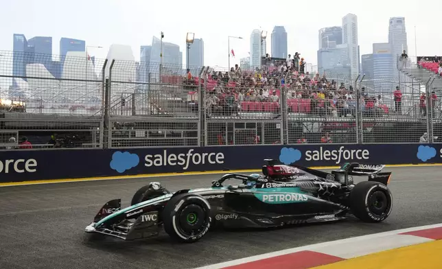 Mercedes driver George Russell of Britain steers his car during the first practice session of the Singapore Formula One Grand Prix at the Marina Bay Street Circuit, in Singapore, Friday, Sept. 20, 2024. (AP Photo/Vincent Thian)