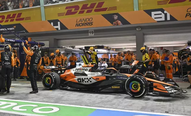 McLaren driver Lando Norris of Britain of leaves pit lane during the Singapore Formula One Grand Prix at the Marina Bay Street Circuit, in Singapore, Sunday, Sept. 22, 2024. (Mohd Rasfan/Pool Photo via AP)