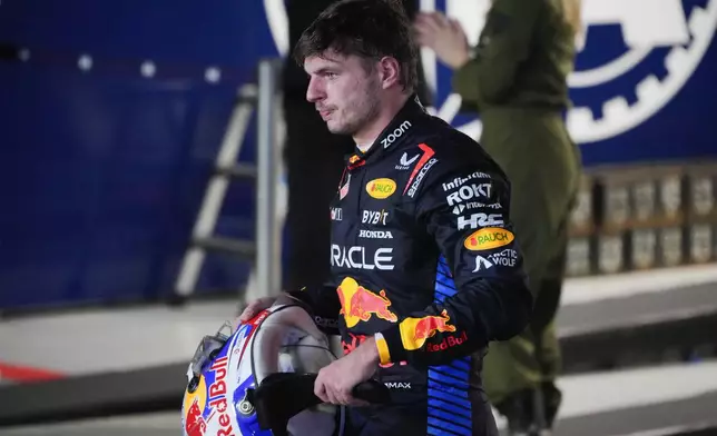 Red Bull driver Max Verstappen of the Netherlands reacts after his second place finish in the Singapore Formula One Grand Prix at the Marina Bay Street Circuit, in Singapore, Sunday, Sept. 22, 2024. (AP Photo/Vincent Thian)